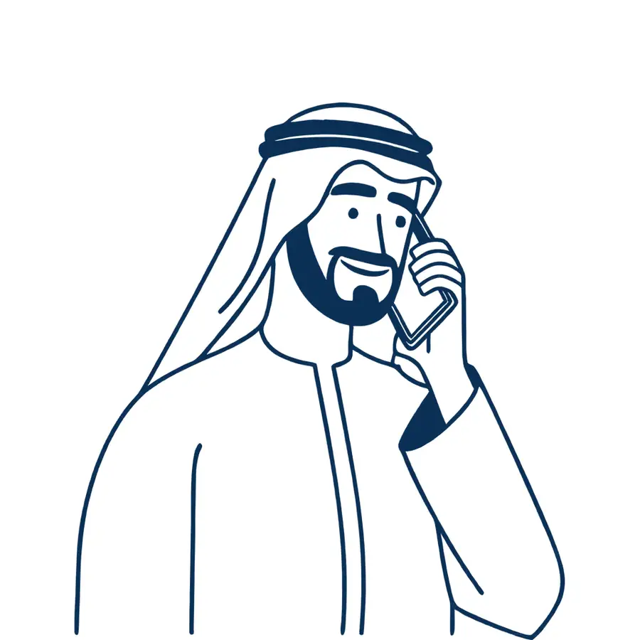A man in a thobe, ghutra and egal laughing on a phone call