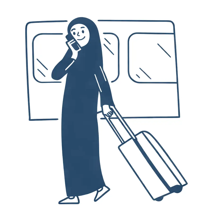 A woman in an abaya walking through an airport with her suitcase, talking on the phone