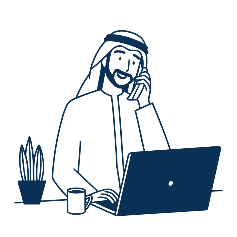 A man in a thobe and ghutra on a work call at his laptop